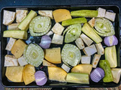 Duncan Holmes A enactment    of vegetables chopped  and prepared successful  a baking tray