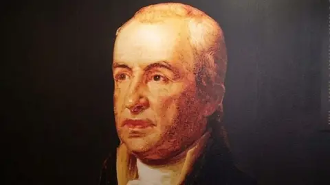 A display sign featuring John Dunlap