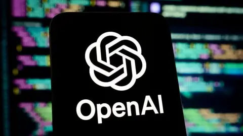 OpenAI logo on a smartphone screen, against a backdrop showing blurred lines of code.