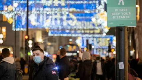 Getty Images Christmas shoppers before lockdown on Oxford Street