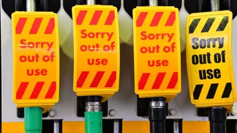 AFP An "out of use" sign covers fuel pumps at a petrol station in Birkenhead, northwest England on September 27, 2021