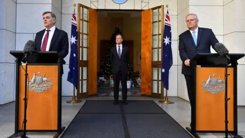 Reuters/AAP Dr Brendan Murphy speaking at a coronavirus press conference with Prime Minister Scott Morrison and Health Minister Greg Hunt in Canberra in 2020