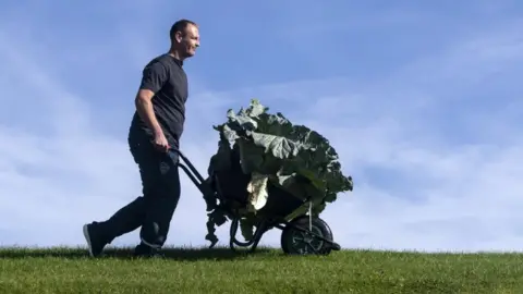 PA Media Craig Pearson with his winning giant cabbage