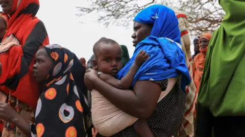 Reuters Internally displaced Ethiopians queue to receive food aid in the Higlo camp for people displaced by drought, in the town of Gode, Somali Region