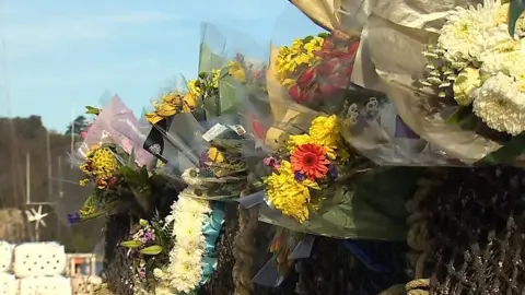 Flowers for missing fishermen