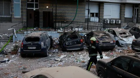 Reuters Destroyed cars in Kyiv, Ukraine. Photo: 30 May 2023