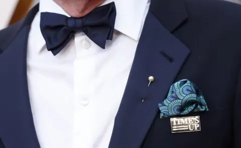 Reuters Richard Jenkins wearing a Time's Up pin