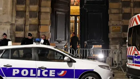 AFP Police vehicles parked outside the government spokesman's ministry on 5 January 2019