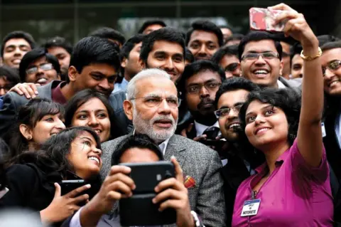 PTI Prime Minister Narendra Modi takes a selfie with Indian employees during a visit to the Airbus facility in Toulouse, France, 2015