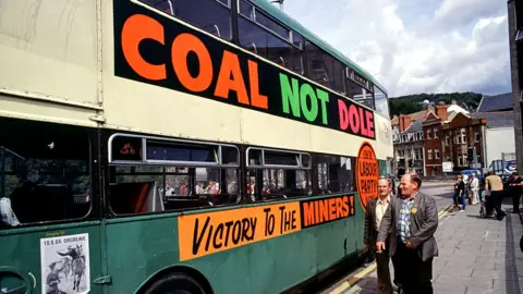 Getty Images Bus with "Coal not dole" slogan on the side