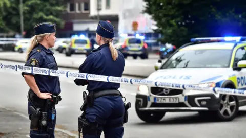 Getty Images Swedish police responding to a crime in Malmo (file pic)