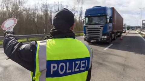 EPA German Federal police officers check vehicles at the border to France due the Coronovirus Epidemic in Neulauterburg near Karlsruhe, Germany, 13 March 2020