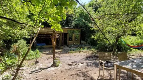 Sam Hall A forester's cabin in the woods