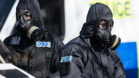 Getty Images Police officers in protective suits in Salisbury in March 2017