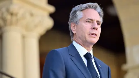 Getty Images Secretary of State Antony Blinken answers questions by the media at Stanford University in Stanford, California