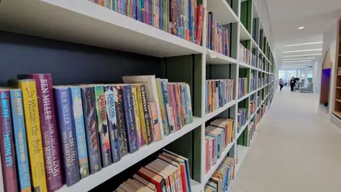 LDRS Books on the shelf inside the new library