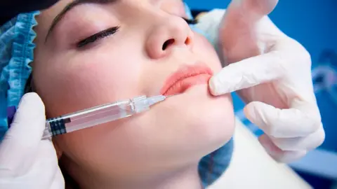 Getty Images Woman gets lip fillers