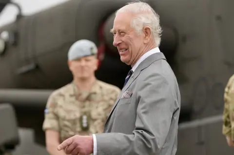 PA Media King Charles III speaks to service personnel, during a visit to the Army Aviation Centre at Middle Wallop, Hampshire