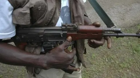 Getty Images Man with a gun