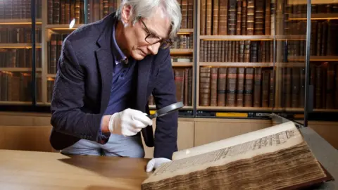 National Archives Geoffrey Marsh looking at archived records