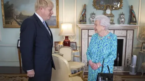 PA Media Boris Johnson pictured with the Queen on 24 July at Buckingham Palace where she invited him to become Prime Minister.