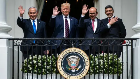 Getty Images Former Israeli Prime Minister Benjamin Netanyahu, Former US President Donald Trump, Bahrain Foreign Minister Khalid bin Ahmed Al Khalifa, and United Arab Emirates Foreign Minister Abdullah bin Zayed Al-Nahyan