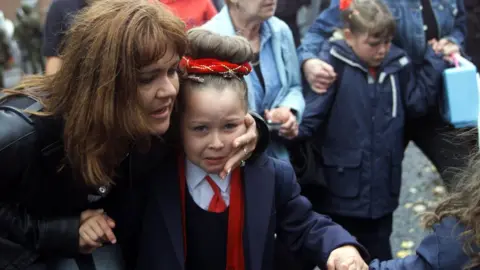 Getty Images Holy Cross pupil and parent