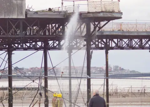 Colwyn Bay Watersports Firefighters tackle a fire at Colwyn Bay pier