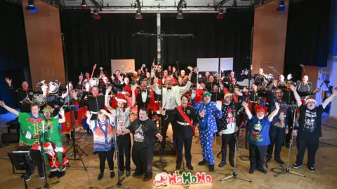 PA Media The Music Man Project has teamed up with the Royal Marines Band to record a Christmas single in tribute to the late MP Sir David Amess