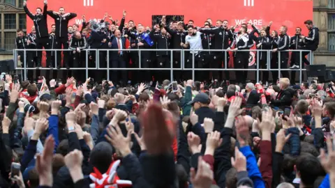 Danny Lawson/PA Sheffield United celebrate promotion to the Premier League