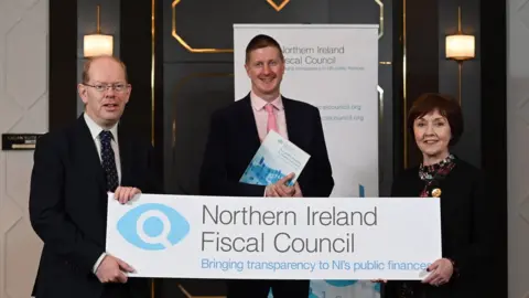 Michael Cooper Photography Dr Esmond Birne, Sir Robert Chote and Maureen O’Reilly from the NI Fiscal Council