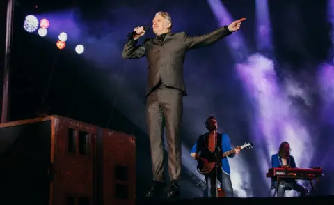 Tom Joy Chumbawamba frontman Dunstan Bruce with Hope and Social on stage at Leeds 2023 opening ceremony