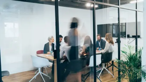 Getty Images Office workers