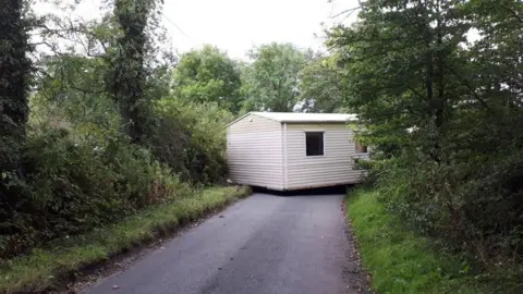 West Mercia Police Mobile home blocking road