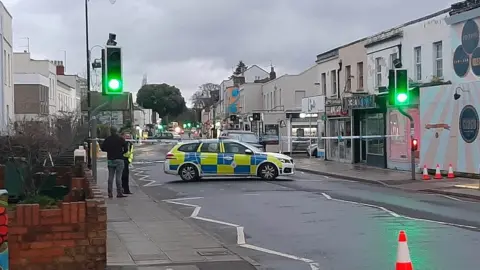 Spotted: Cheltenham Police cordon in Cheltenham with a police car inside it