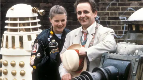 Sophie Aldred as Ace and Sylvester McCoy as The Doctor in their 1988 adventure Remembrance of the Daleks