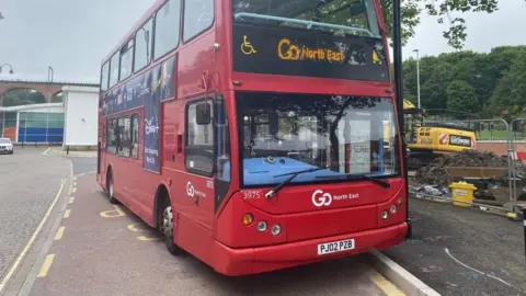 A red Go North East bus in Chester-le-Street