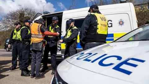 Essex Police Police officers arrest a climate change protestor in Thurrock on 2 April 2022