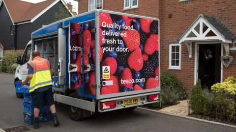 Getty Images Tesco van delivering to a home