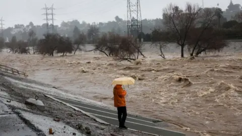 Reuters The LA River is around 10-12ft above flood stage