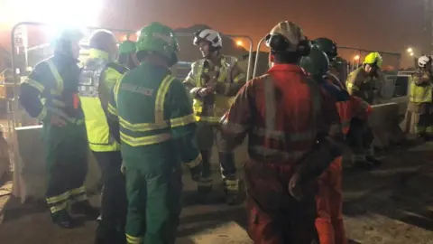 Essex Fire and Rescue Service Fire crews talking to partner agencies