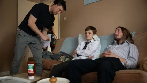 AFP Nick Holt with Billy Barratt who plays Ray and James Tarpey