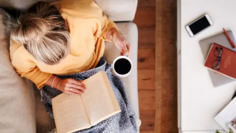 Getty Images Woman reading book