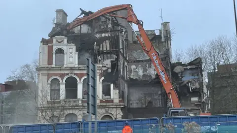 BBC Grosvenor Hotel being demolished by a crane