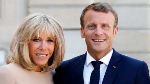 Brigitte Macron (left) and her husband Emmanuel