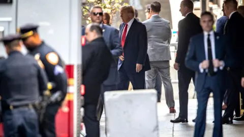 John Moore Donald Trump leaves Trump Tower