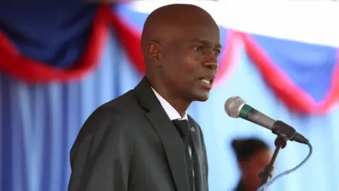 Reuters President Jovenel Moise at an event marking eighth anniversary of earthquake, speaking on stage in Port-au-Prince