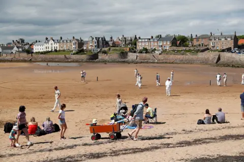 Reuters Cricket match at Elie beach