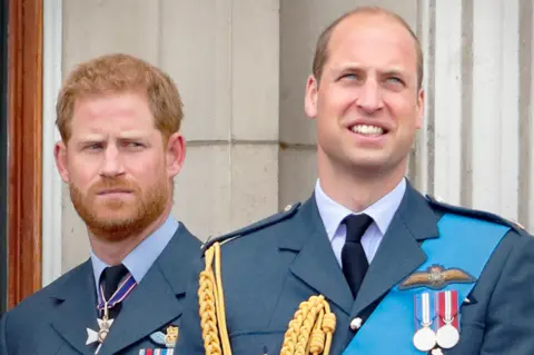 Getty Images Princes Harry and William watch a flypast to mark the centenary of the RAF, 2018