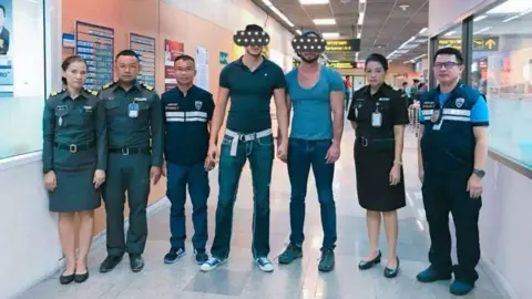 Thai Immmigration Police The two US citizens at the airport
